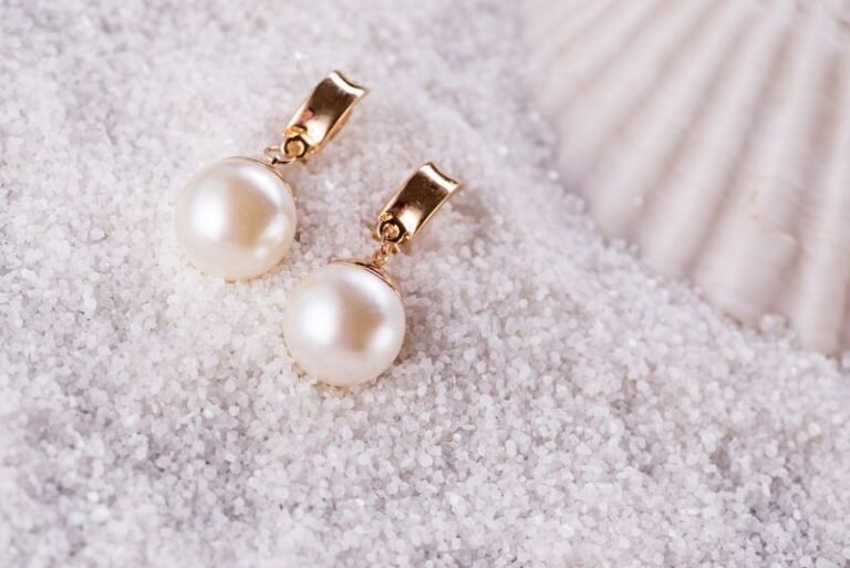 Golden earrings and sea shell